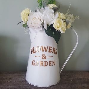 Watering can floral arrangement